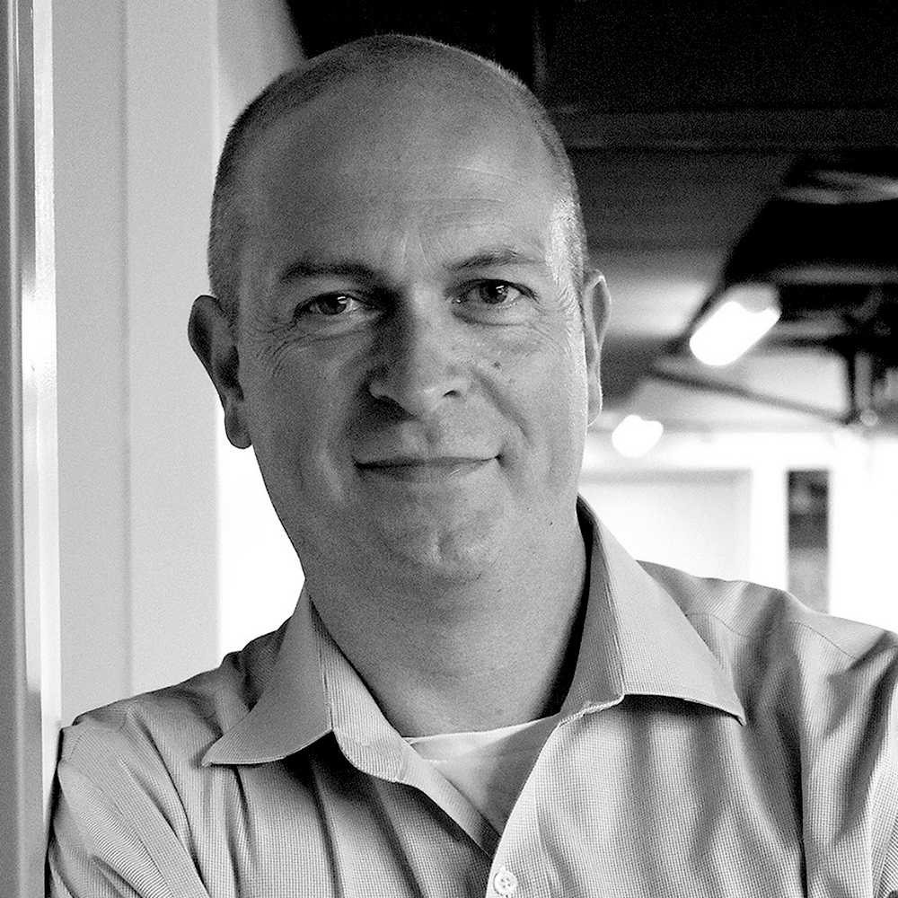 Our Team- Black and white photo of Simon Barker
